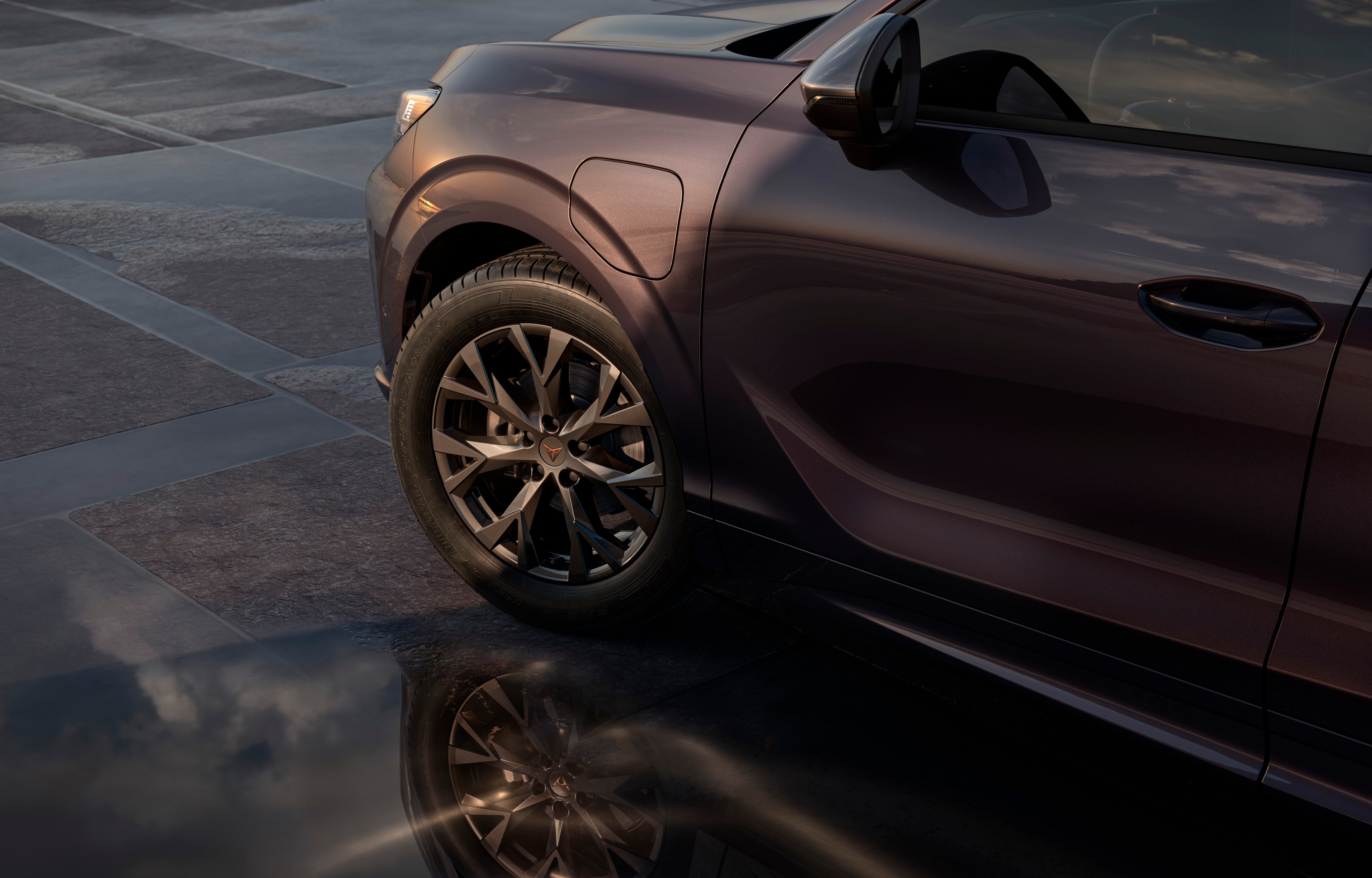 phev cupra leon sportstourer in motion, urban setting at sunset