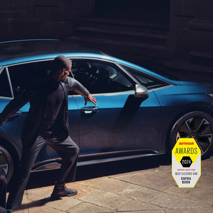 Man next to Aurora Blue CUPRA Born