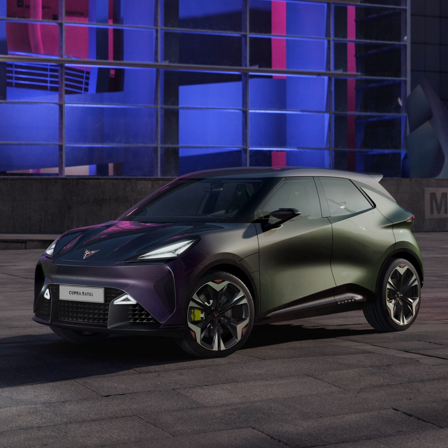 A CUPRA Raval at night in a city setting