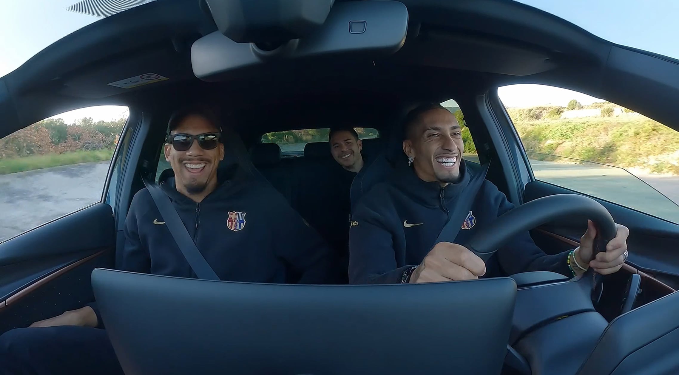 Barcelona FC players driving a CUPRA Terramar