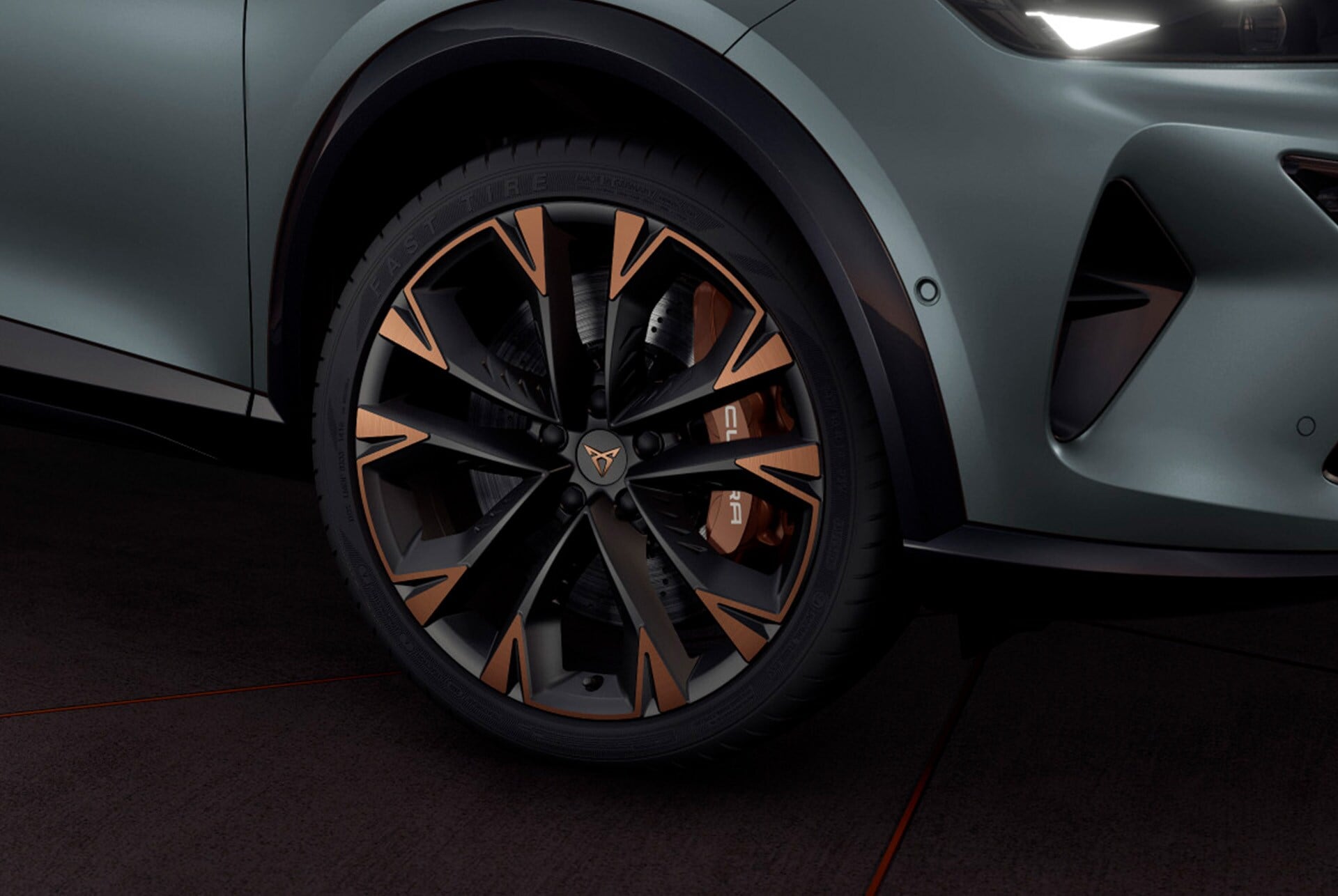 Exterior view of the CUPRA Formentor 2026 copper accent wheels, Akebono brakes, wing mirror, tyres, signature triangle eye LED headlights and CUPRA logo.
