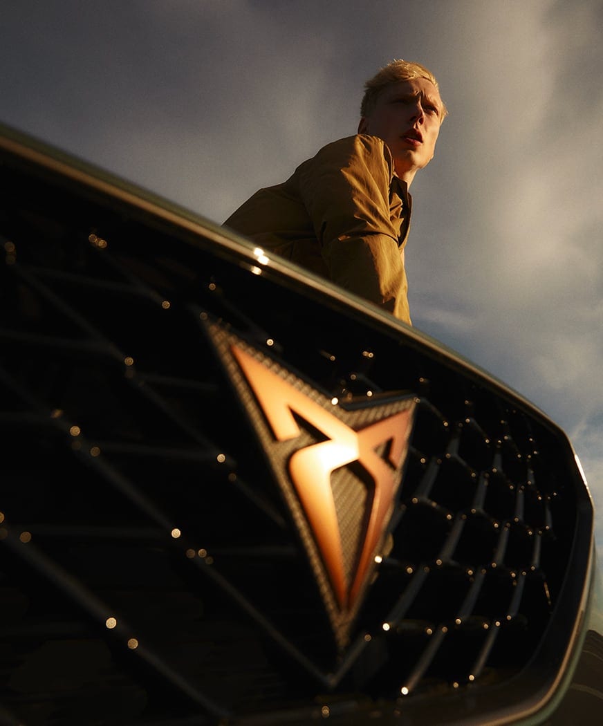 Man%20looking%20into%20the%20distance%20next%20to%20a%20CUPRA