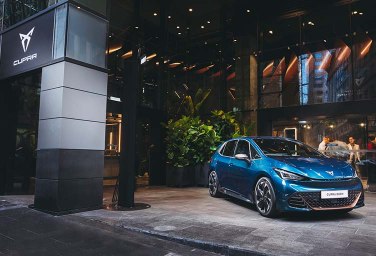 an electric blue Born parked outside  CUPRA City garage Sydney