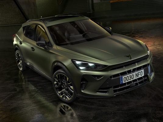 new cupra formentor offer, suv in century bronze matt, model year 2025, with 19 inch artic copper wheels and cityscape background. New car offers available.