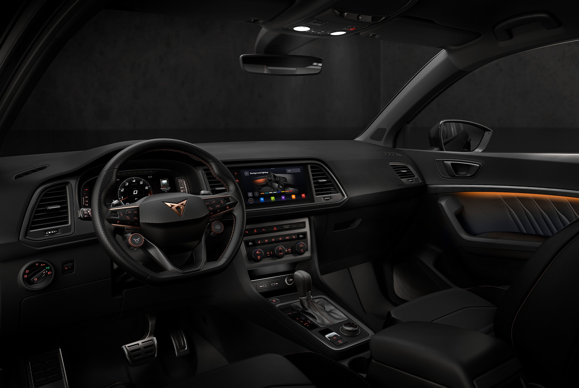 The interior of the cupra ateca highlighting advanced technology features. The dashboard displays a large infotainment screen with navigation and the steering wheel with satellite buttons has integrated controls. A woman is seated inside. 