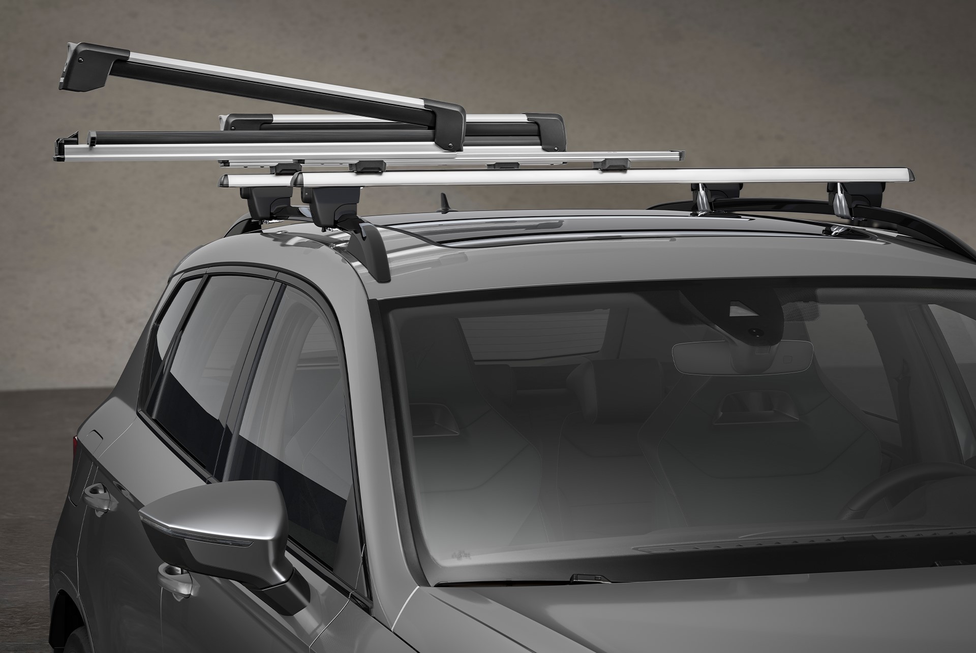 CUPRA Ateca in a snowy setting equipped with a ski rack X-Tender, easily sliding out for convenient ski loading.