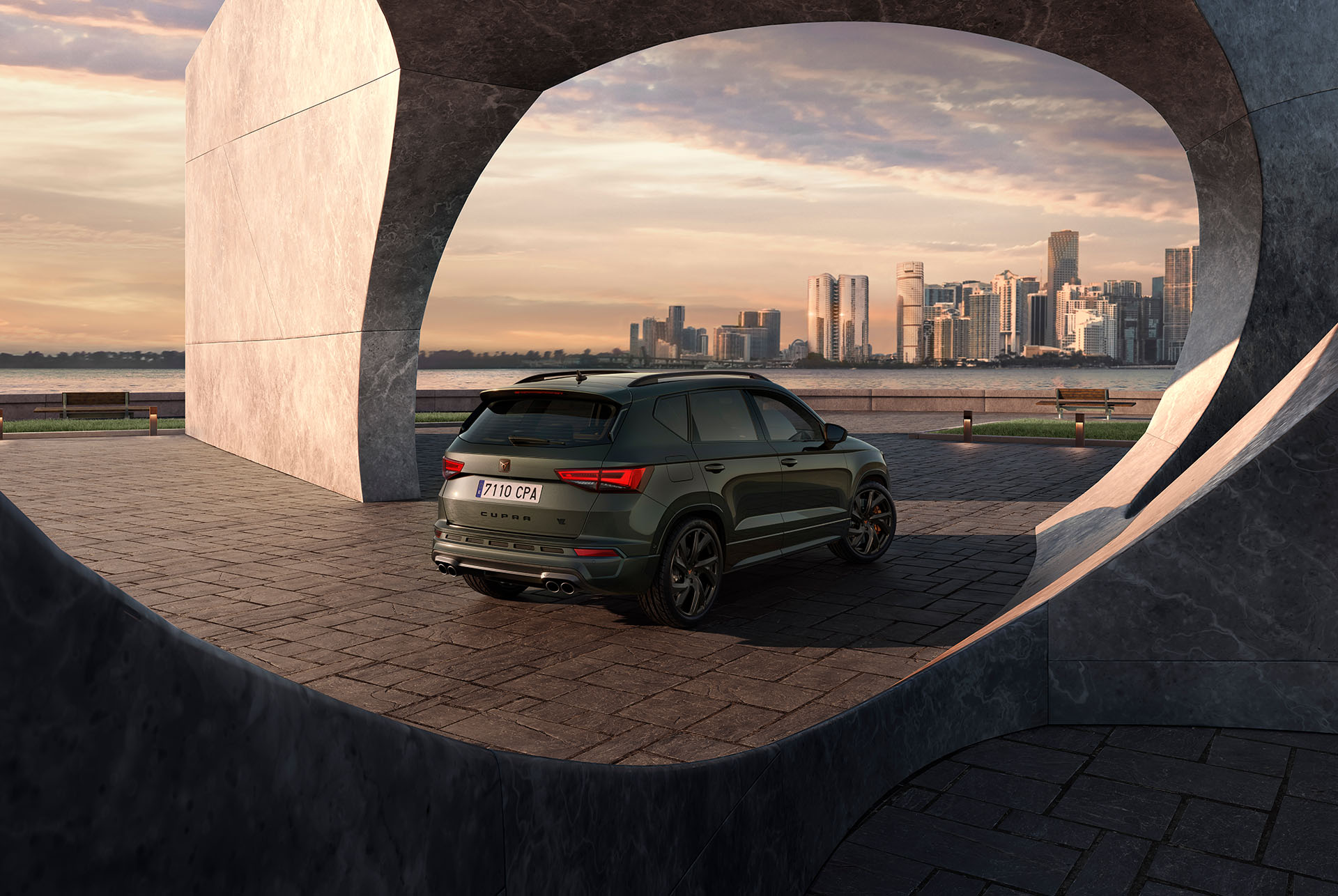 Rear view of the CUPRA Ateca Tribe Edition against a cityscape backdrop, highlighting its bolder design, 300hp engine.
