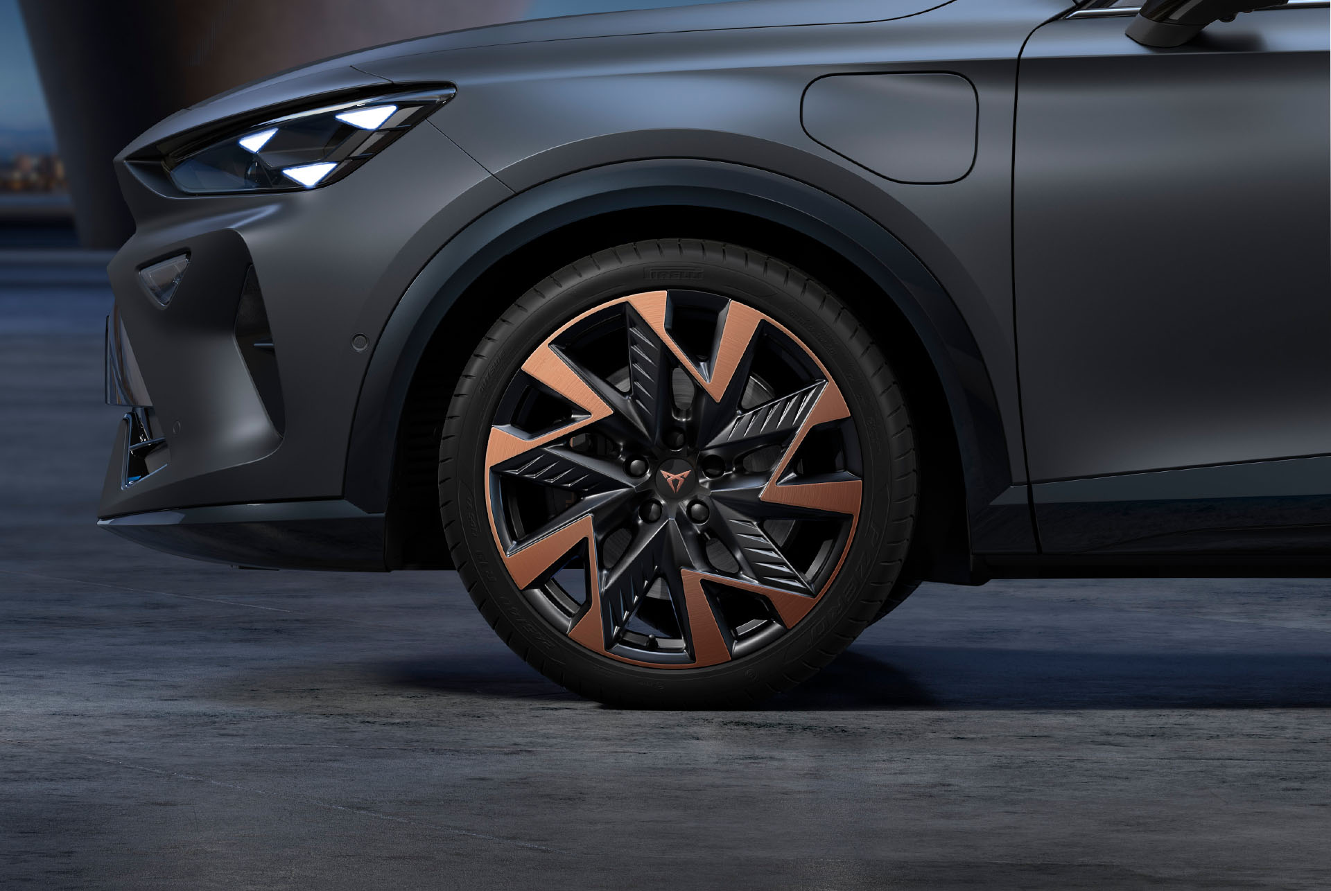 Sandstorm black and copper new CUPRA Formentor 2025 alloy car wheels and tyres with logo in the middle.