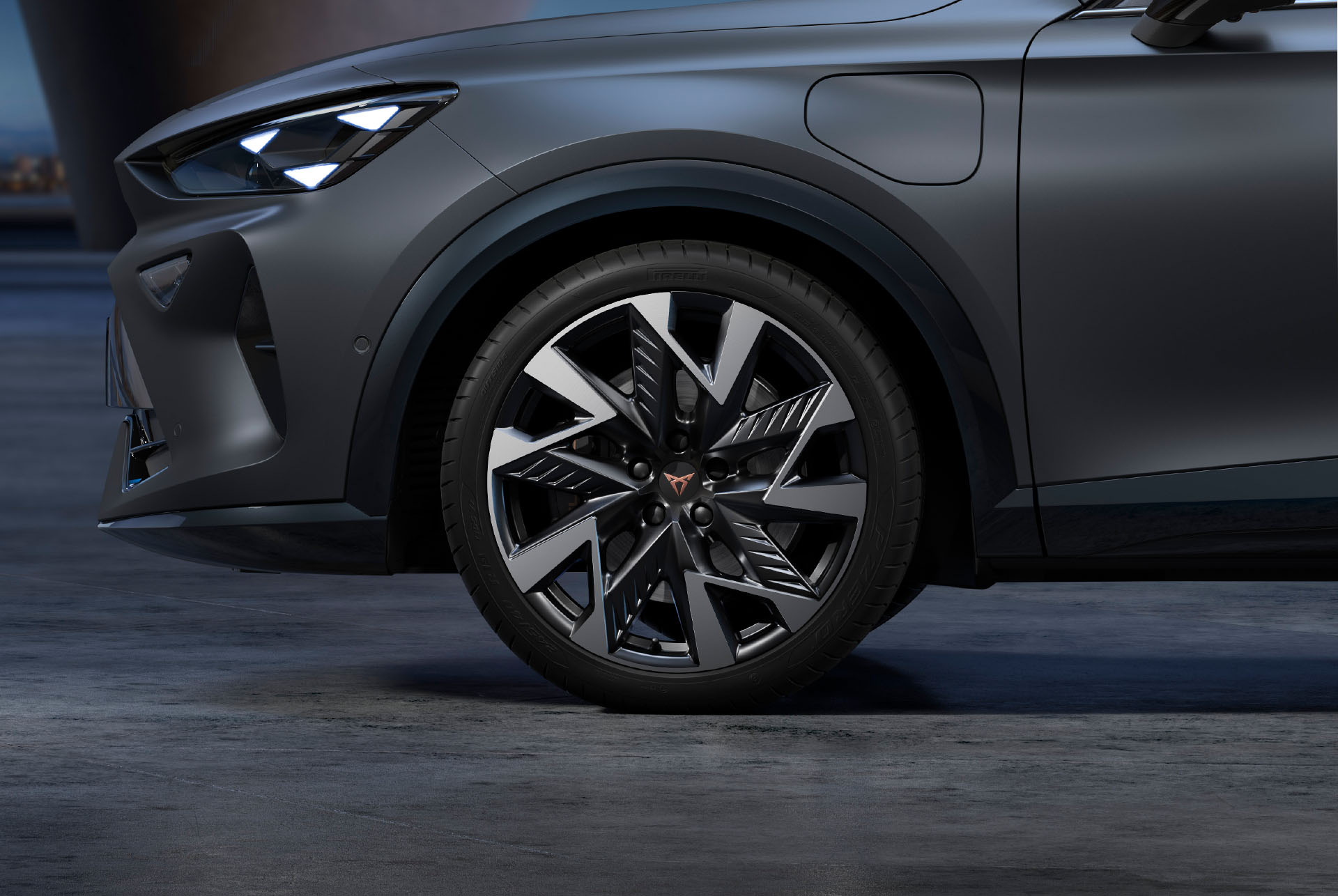 Sandstorm black and silver new CUPRA Formentor 2025 alloy car wheels and tyres with logo in the middle.