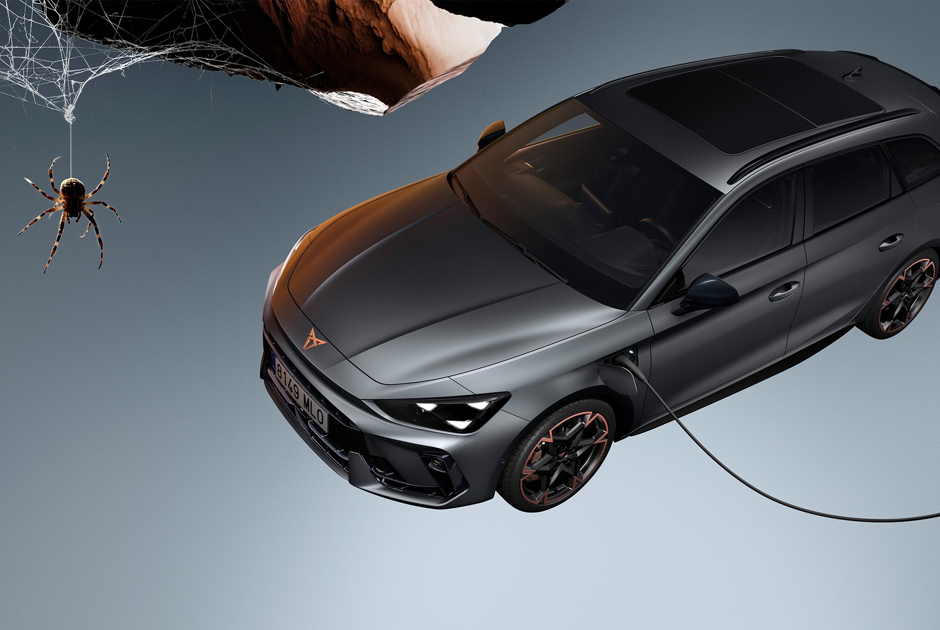 High angle shot of the CUPRA Leon SP being charged and showcasing its desing lines.