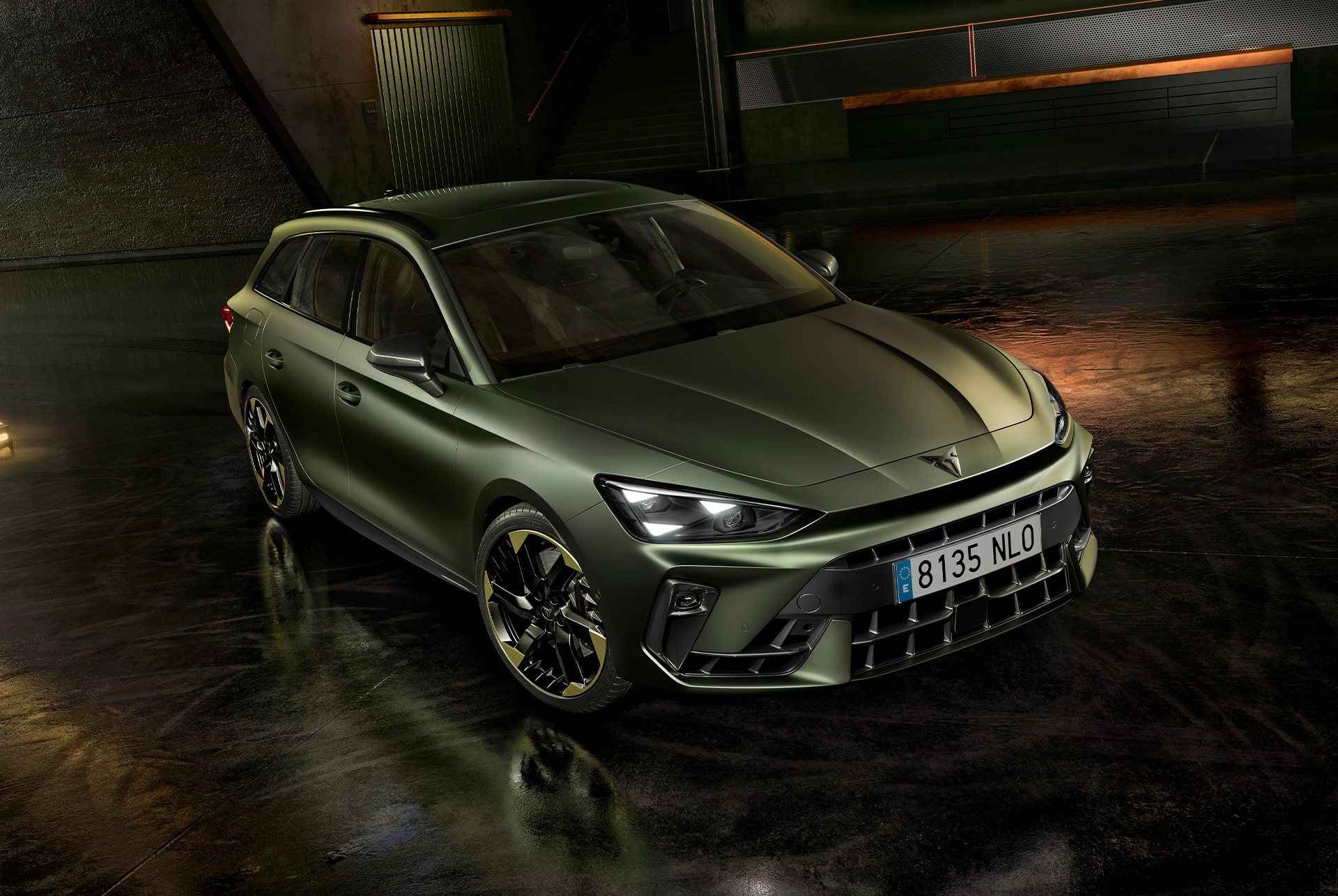 Exterior design of cupra leon sportstourer tribe edition in manganese matt and 19-inch alloy wheels in sulphur, parked in a parking garage.