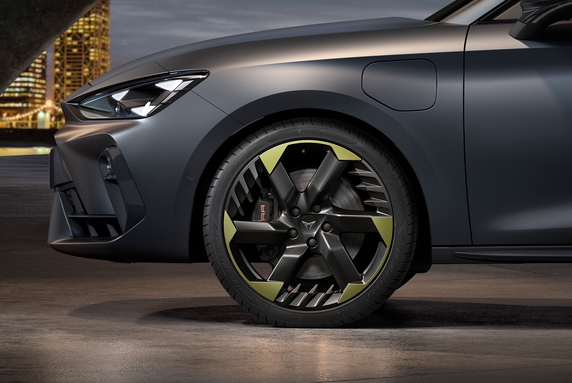 Side view of left 19-inch alloy wheel in sulphur for the new tribe edition, with signature headlights and matt grey body.