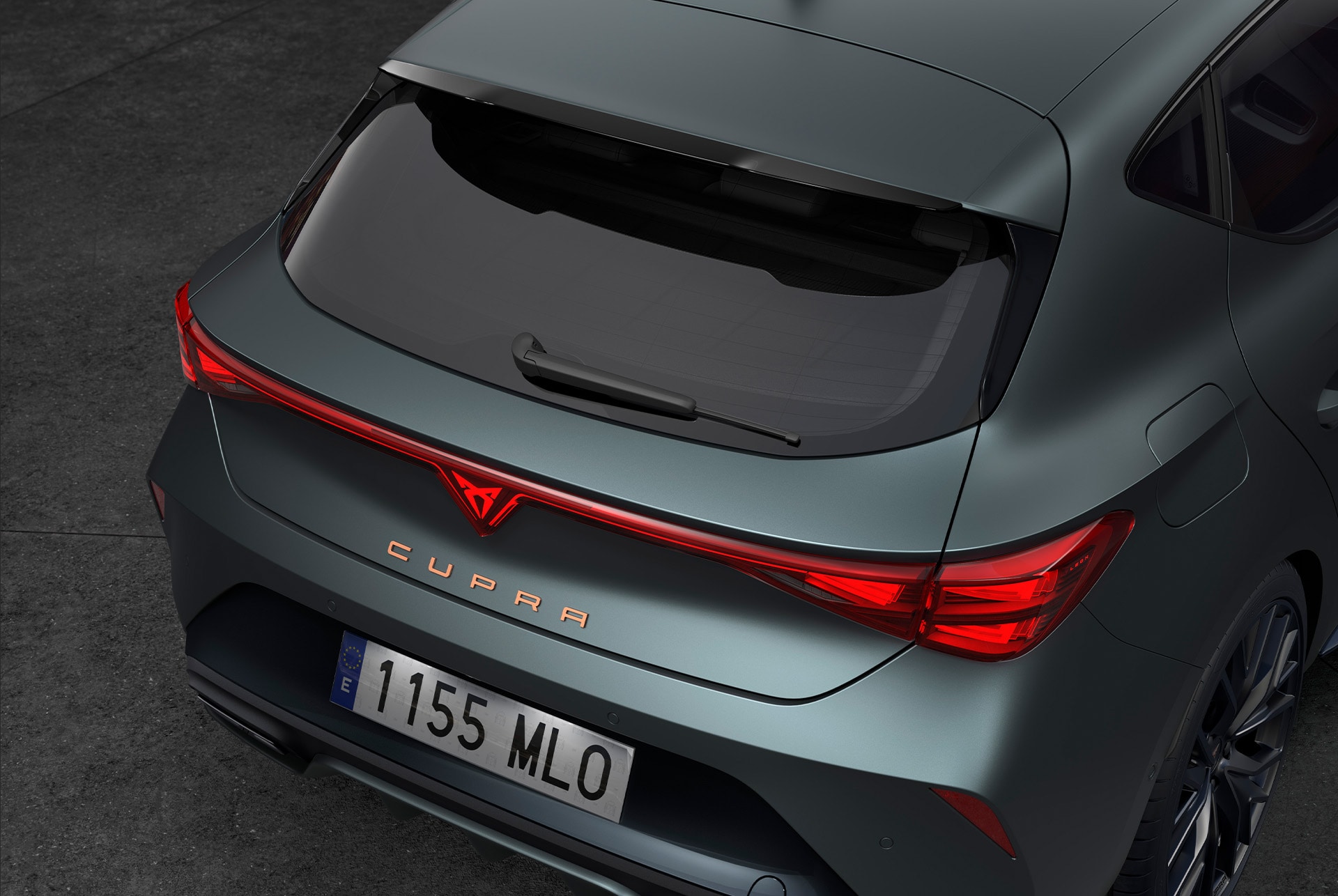 upper shot where it can be seen the rear view of the cupra leon, showcasing the black rear spoiler of the black edition.