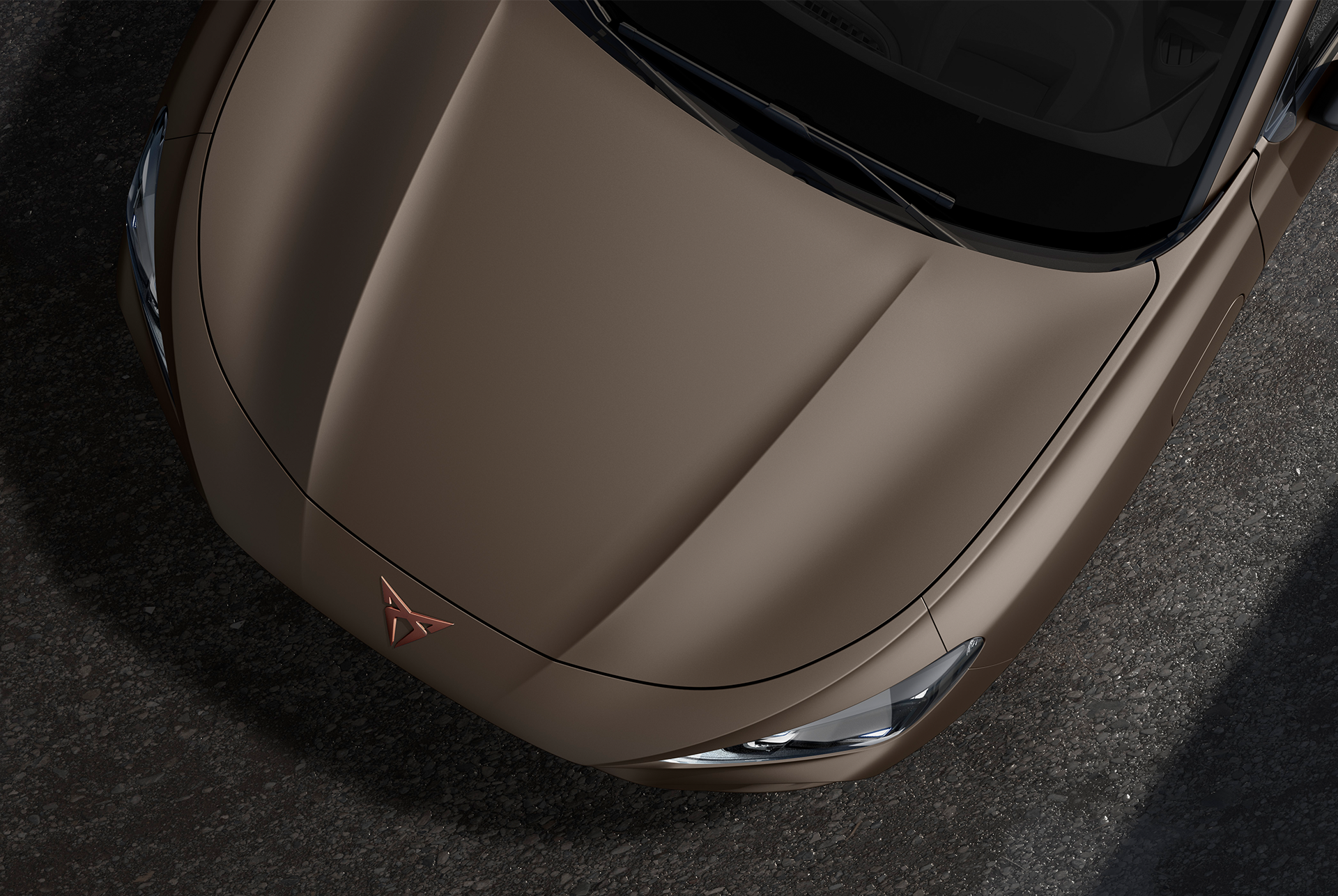 cupra terramar, century bronze matt colour, top-down view of the front hood and headlights.