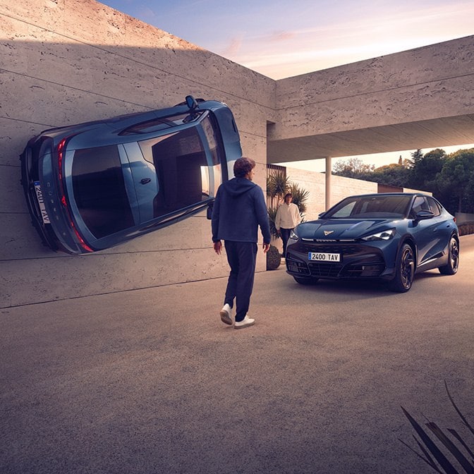 Surreal architectural scene featuring a blue CUPRA car vertically mounted on a concrete wall next to another blue car parked normally in a driveway, with a person walking toward the entrance.