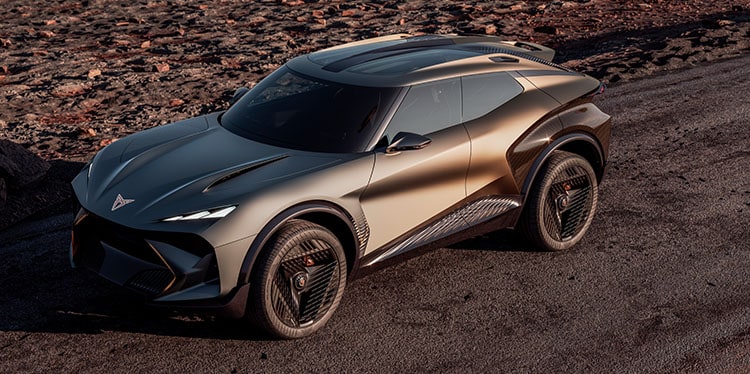 Elevated view of the CUPRA  Tindaya with the headlights on in a desert environment