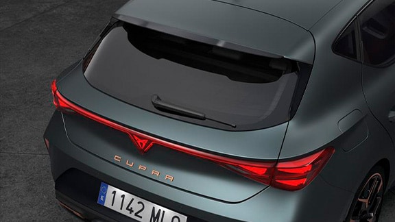 rear view of a cupra vehicle to showcase the carbon fibre spoiler and how it enhances the car's aerodynamics and adds a sporty touch.