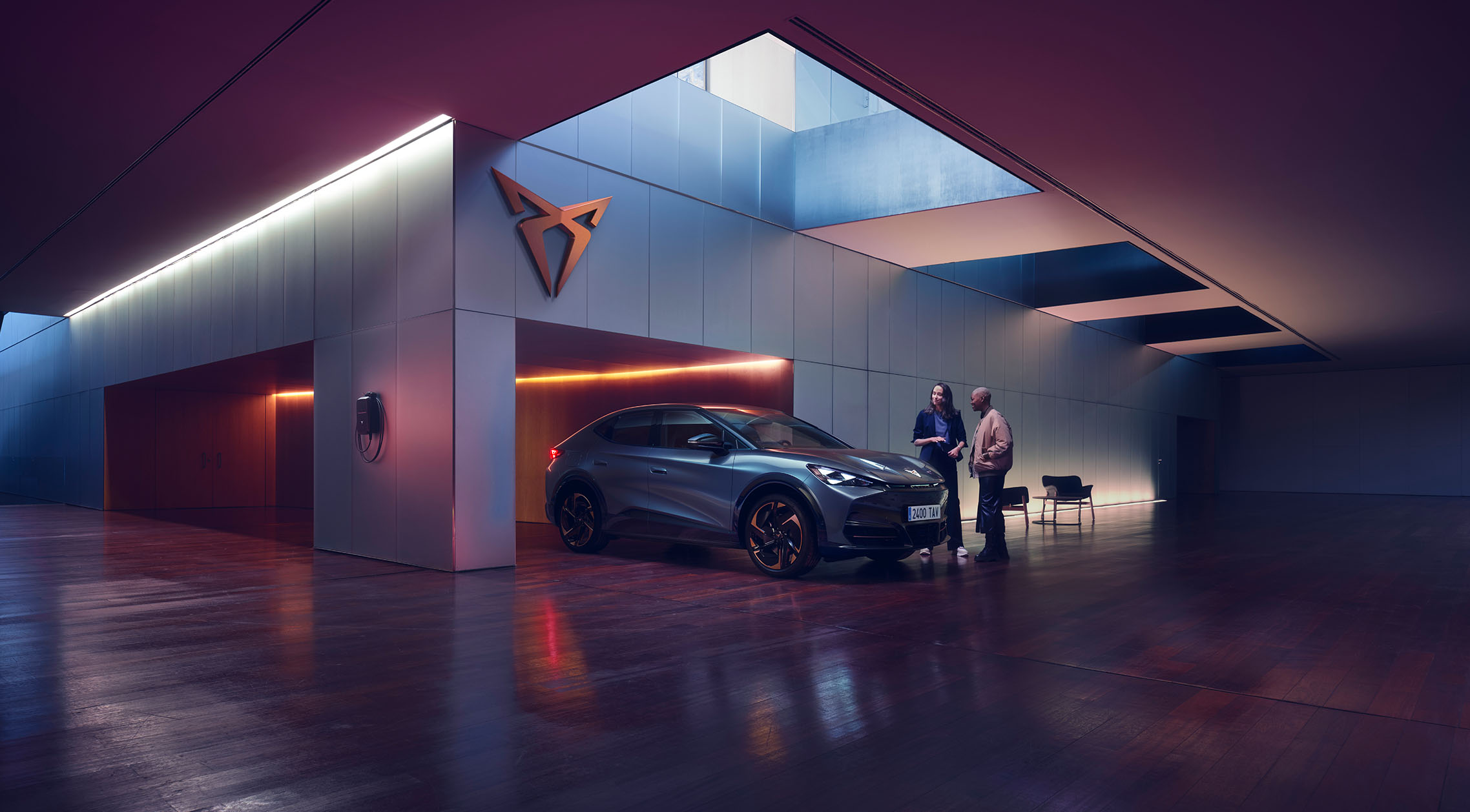 Cupra Tavascan parked in an indoors parking to highlight the fact that you can count on a CUPRA Master at anytime, in every stage of your ownership, even when you have your car already at home.